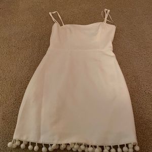 White mini dress with pom-poms at the bottom size 0